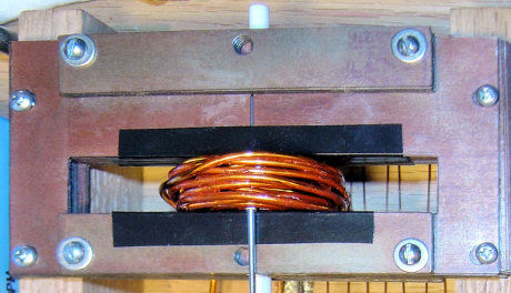 Photo of 56-turn coil installed in iron frame including black tap